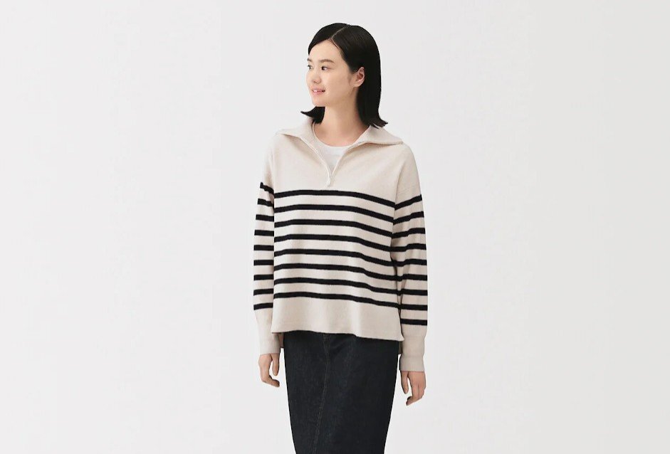 A woman wearing a striped sweater.