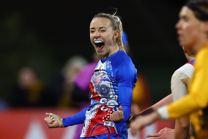 AFLW players during a match.