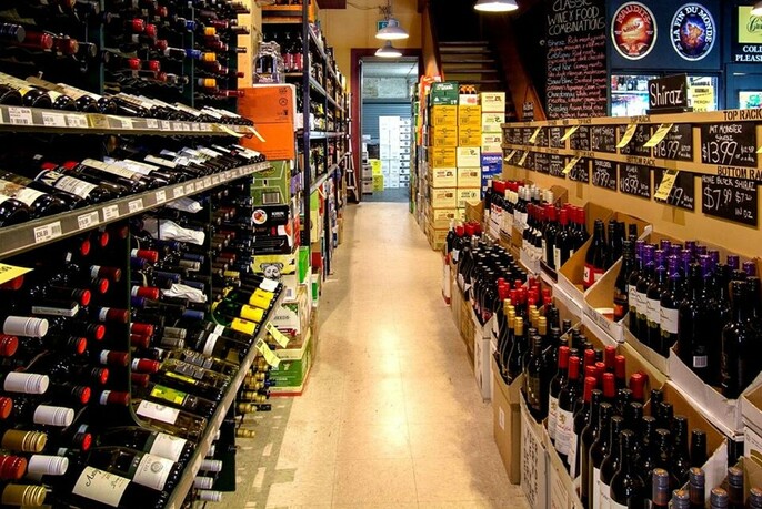 Interior of Parkhill Cellars showing rows and rows of wine bottles.
