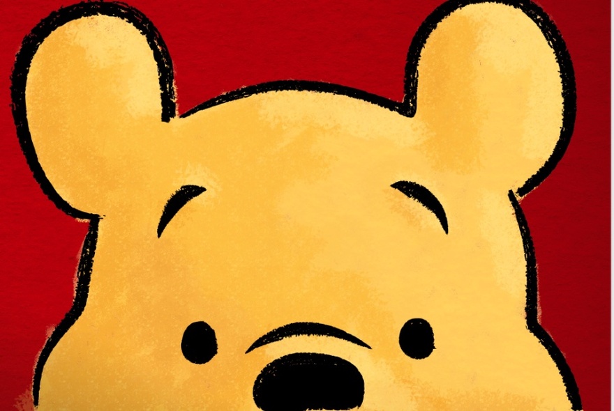 Yellow, illustrated bear from nose up, against dark red background.