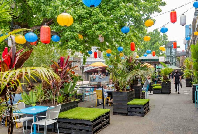 A beer garden with hanging paper lanterns