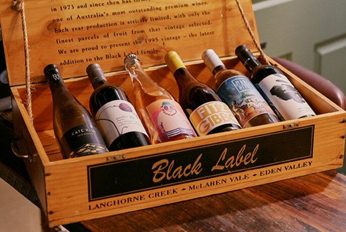 A wine box with six bottles of wine on display.