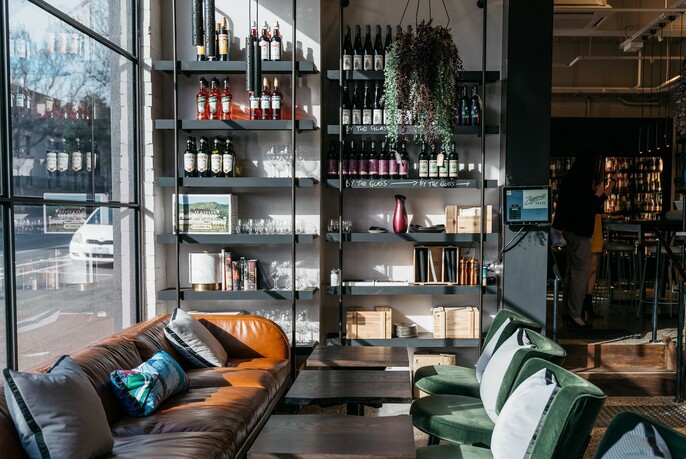 Leather seats and shelves of wine in the window of Lord Lygon.