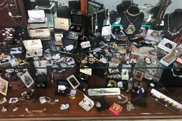 Display cabinet of vintage jewelry.