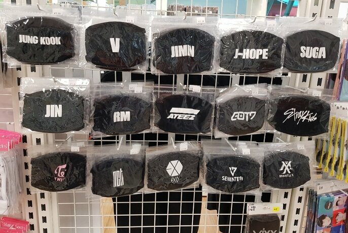 Range of K-pop themed face masks in black.