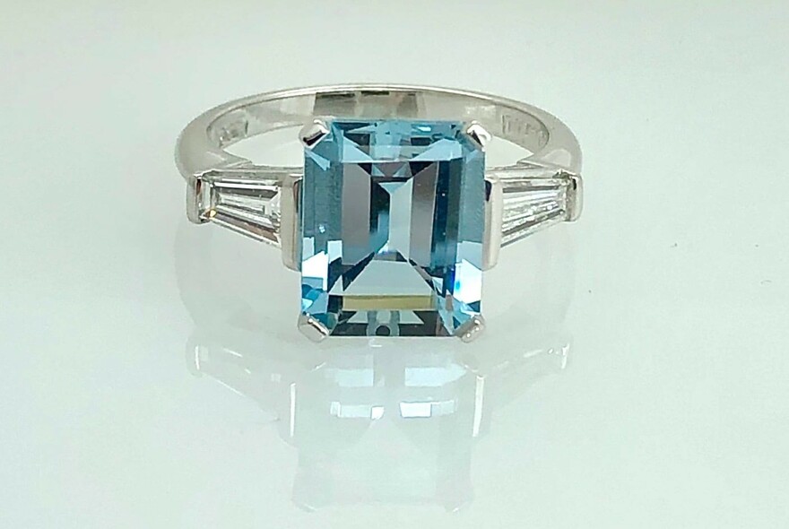 Platinum ring with large square-cut aquamarine.