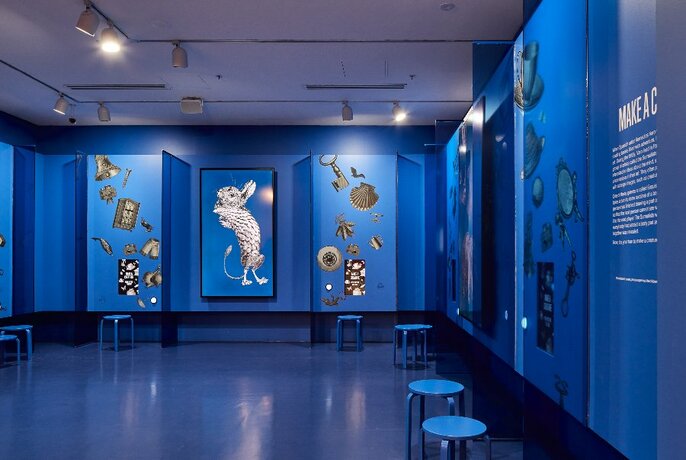 Blue interior of a gallery.