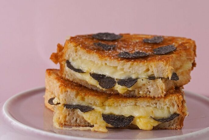 Cheese toastie with shaved truffles.