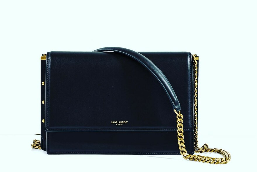 Clutch handbag with chain-detail strap.
