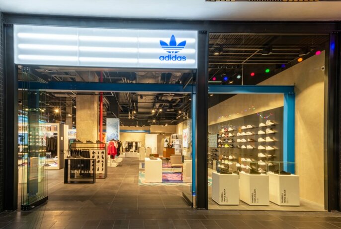 Exterior of the Adidas store with shoes and clothing on display