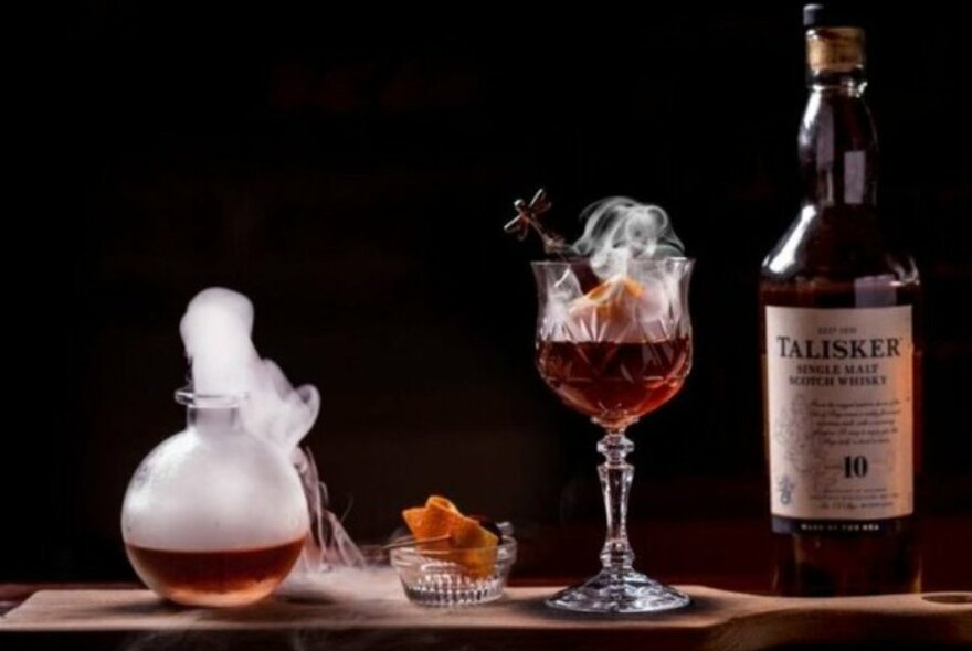 A selection of cocktails with topped with smoke 