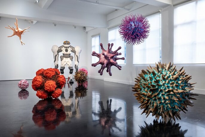 Spherical sculptures in a gallery. 