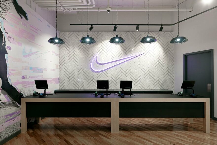 Counter with purple neon Nike swoosh at back.