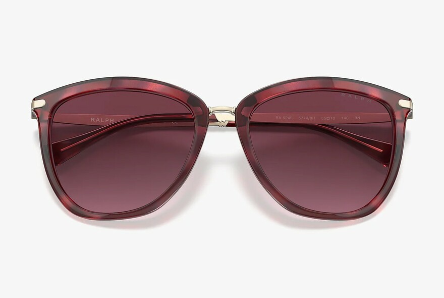 Tortoiseshell sunglasses with purple lenses.