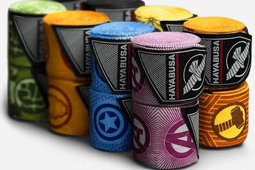 Stack of brightly coloured hand wraps as used under boxing gloves.