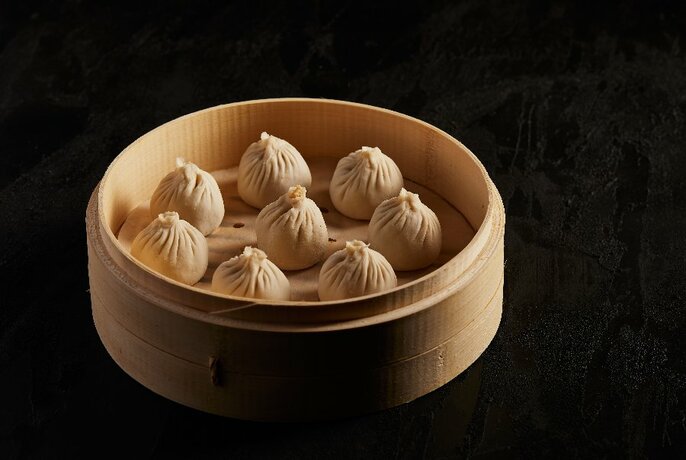 A basket of steamed dumplings.