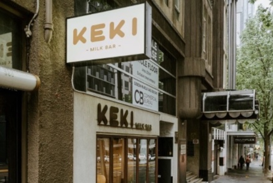 The external view of Keki Milk Bar, with signage and a view down the street.