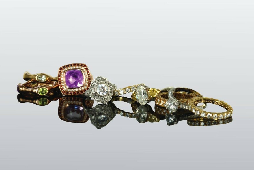 Collection of diamond and gemstone rings.