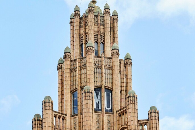 Turreted Gothic-style tower of Manchester Unity Building.