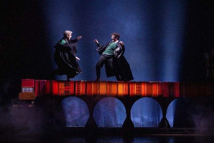 Harry Potter characters fighting with wands live on stage.