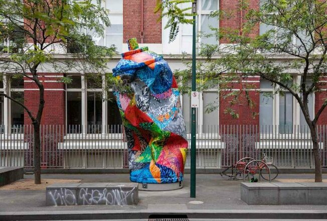 A giant paint can sculpture in a street