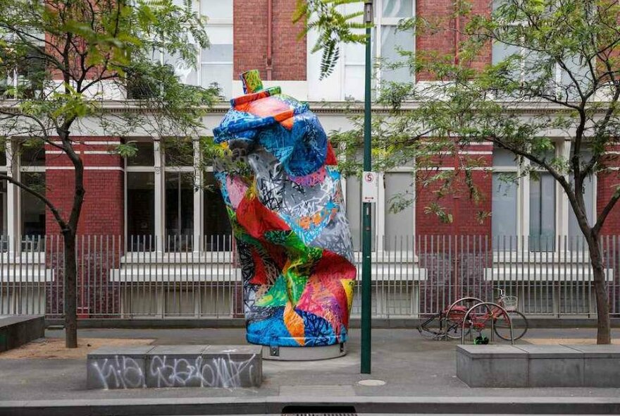 A giant paint can sculpture in a street