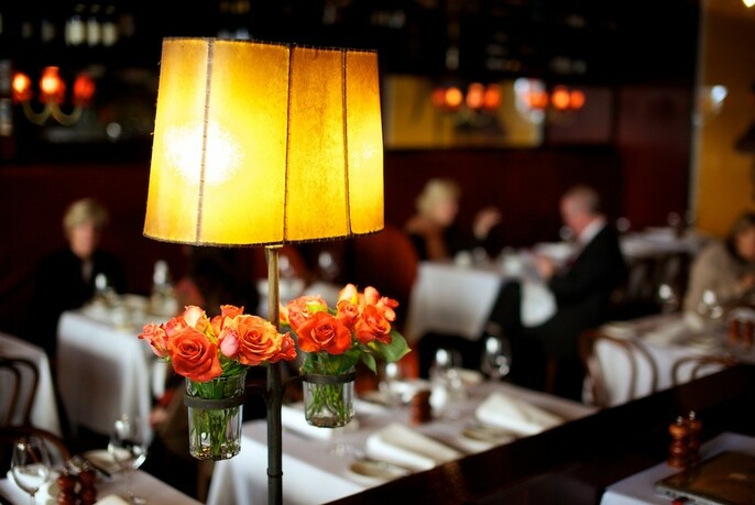 Table lamp with roses in an upmarket restaurant.