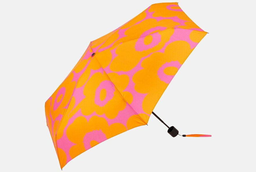 An orange and pink floral umbrella.