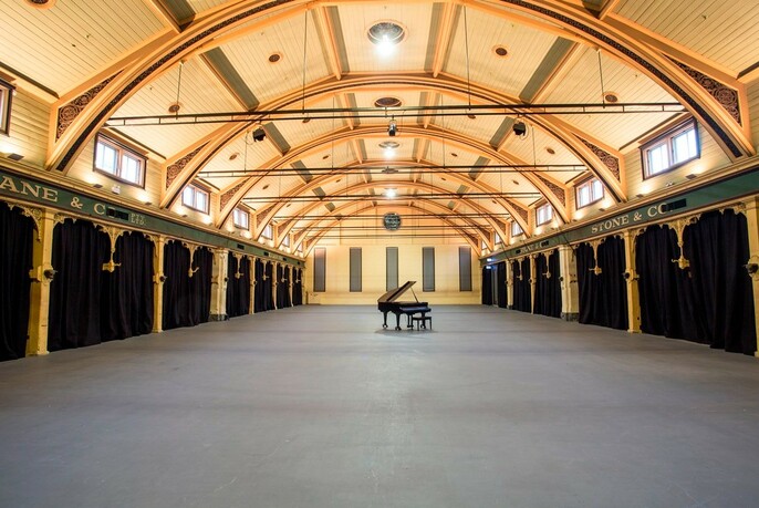 Large indoor space with barrel-vaulted ceiling at heritage-listed Meat Market.