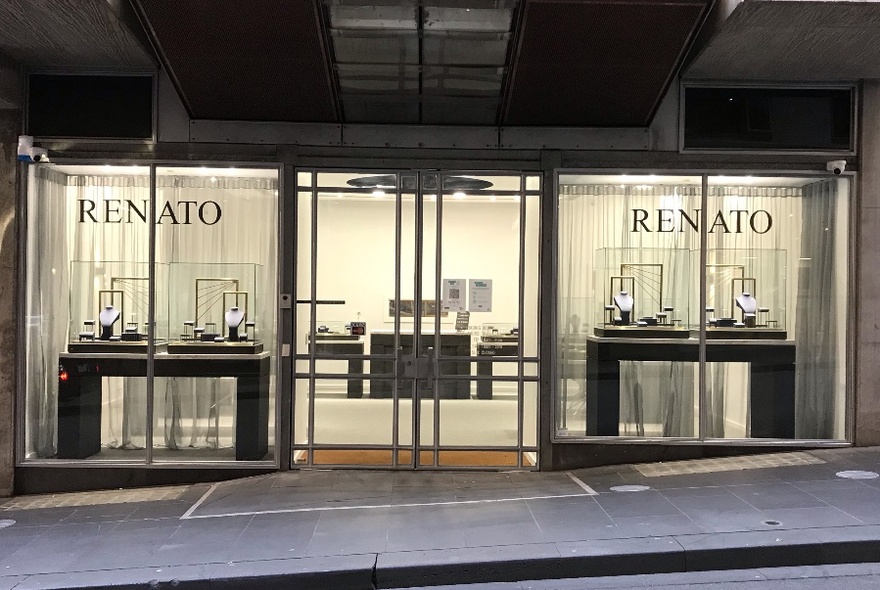 The exterior of Renato Jewellers at night.