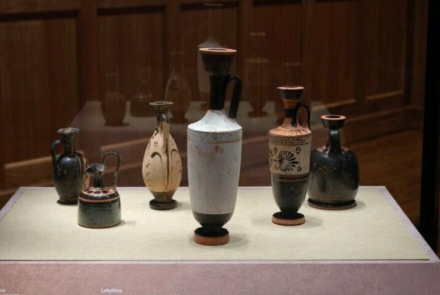 Display case of ancient pottery.