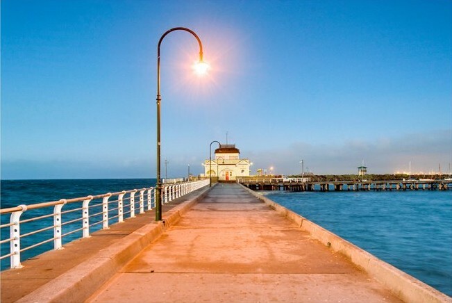 Photograph of Port Melbourne pier at dusk.