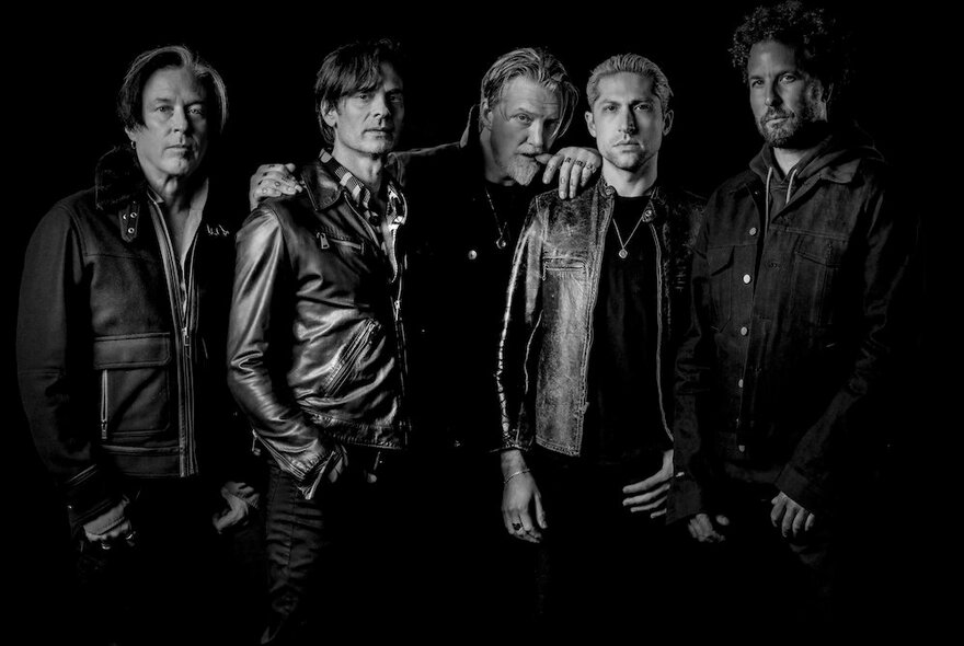 Rock group Queens of the Stone Age, a group of older men wearing leather jackets.