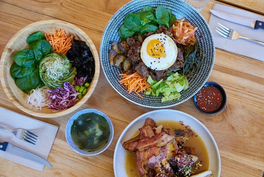 A trio of Korean dishes and sauces. 