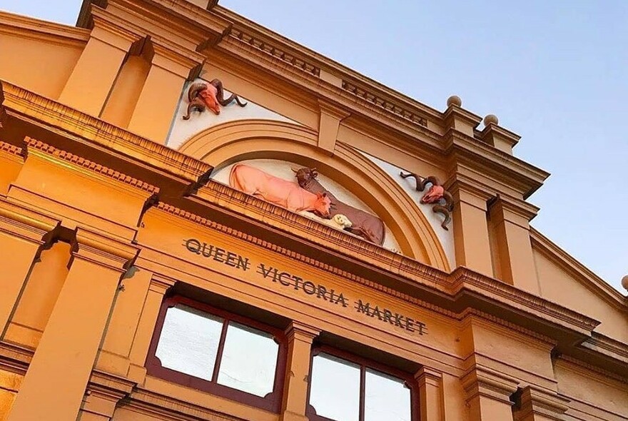 Exterior of the  main entrance of the Queen Victoria Market, looking upwards.