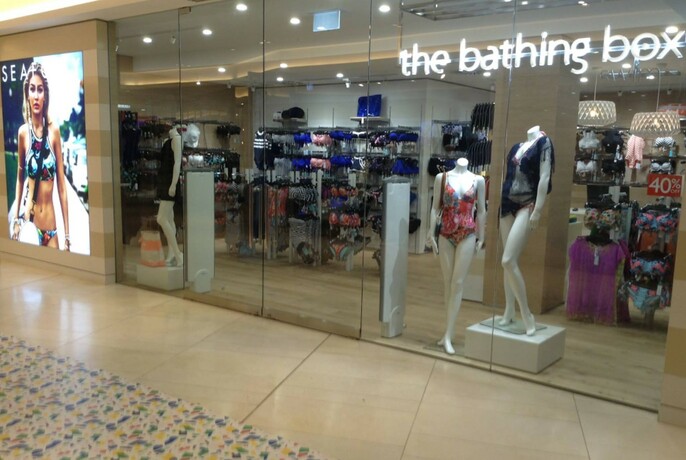 Glass shopfront of the Bathing Box with mannequins in window wearing bathers.