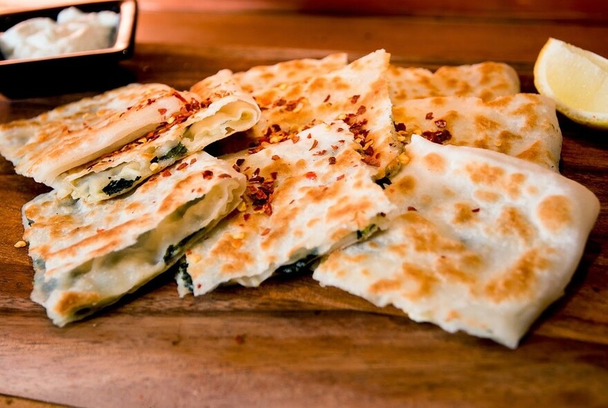 Baked Turkish bread filled with spinach.