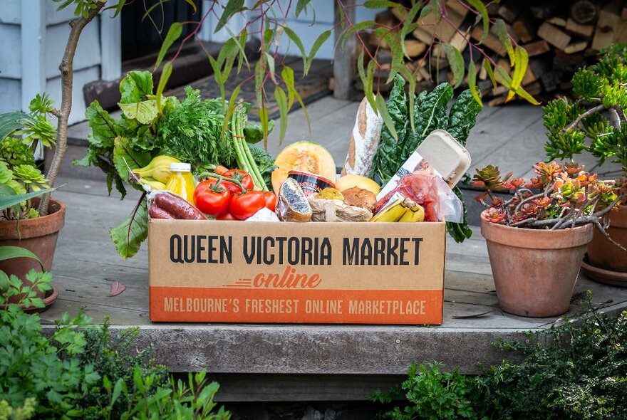 A box full of fresh produce and other food