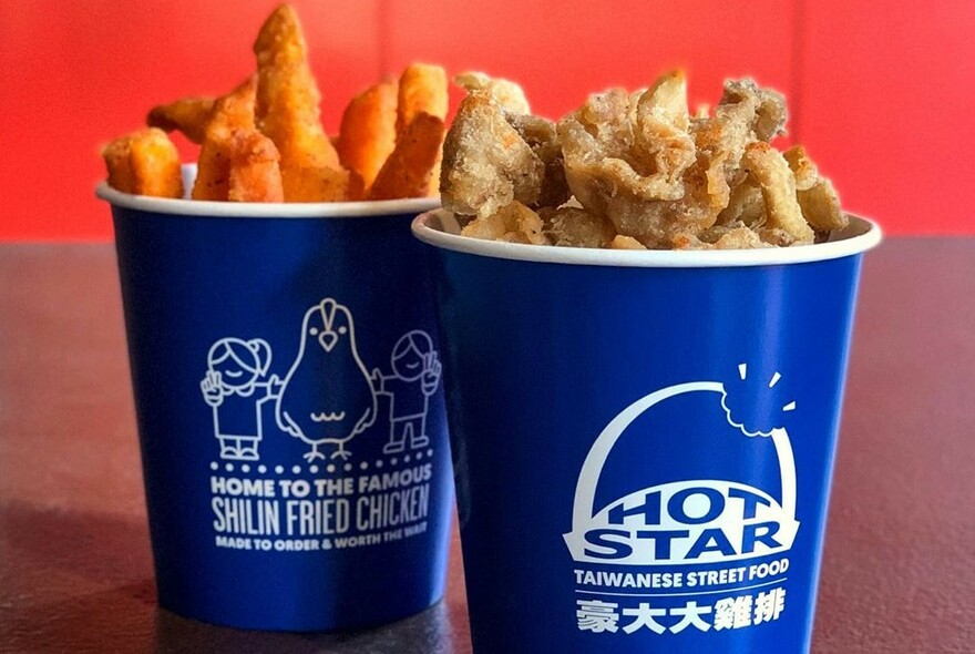 Two small, blue buckets of chips with Hot Star Chips branding.