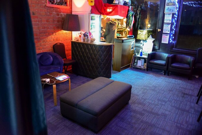 A club area with lots of decor and couches