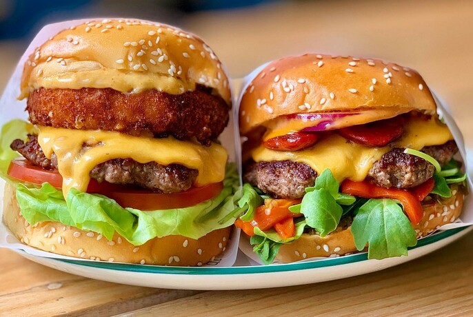 Two well-stacked burgers.
