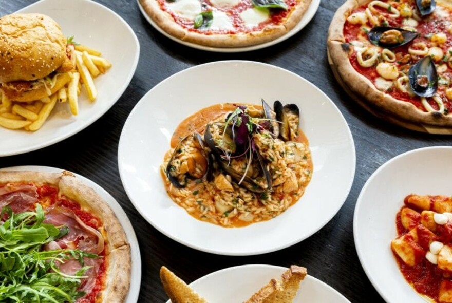 Range of Italian dishes including mussels and pizza.
