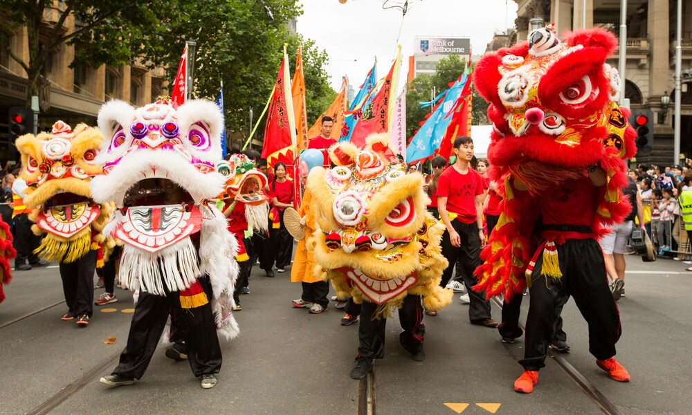 Chinese dragons at the front of a festival parade.