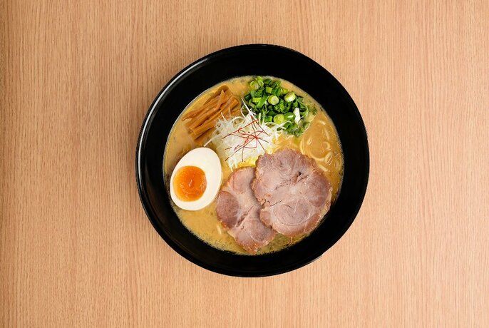 Bowl of Japanese ramen noodles with meat and egg.