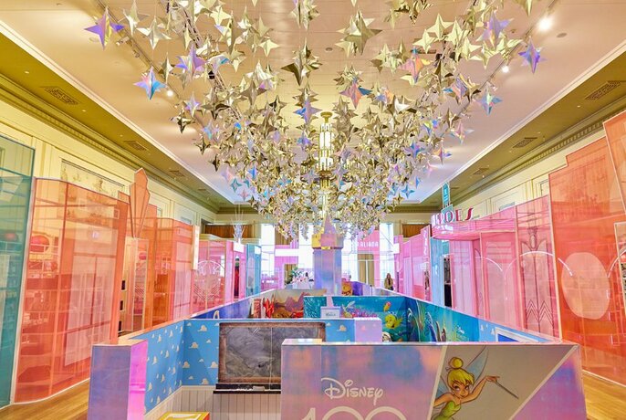 A colourful Disney-themed maze beneath a canopy of silver stars.