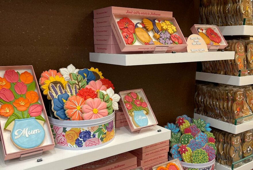 Shelves displayed with packaged decorated cookie products.