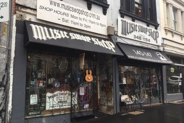 Exterior of the Music Swop Shop showing stock in the window display and signage.
