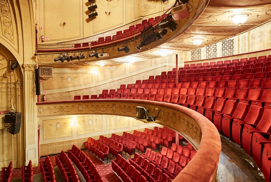 Inside heritage-listed Athenaeum Theatre with tiers of red seats.