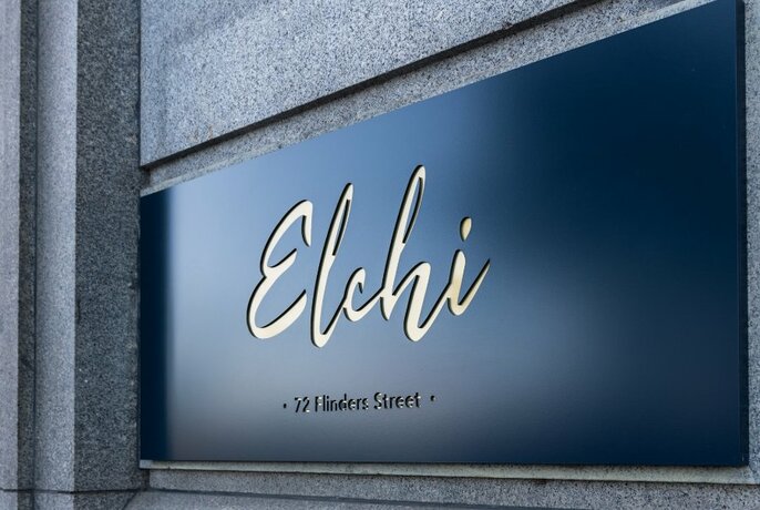 Restaurant signage on a building exterior spelling out the words 'Elchi'.