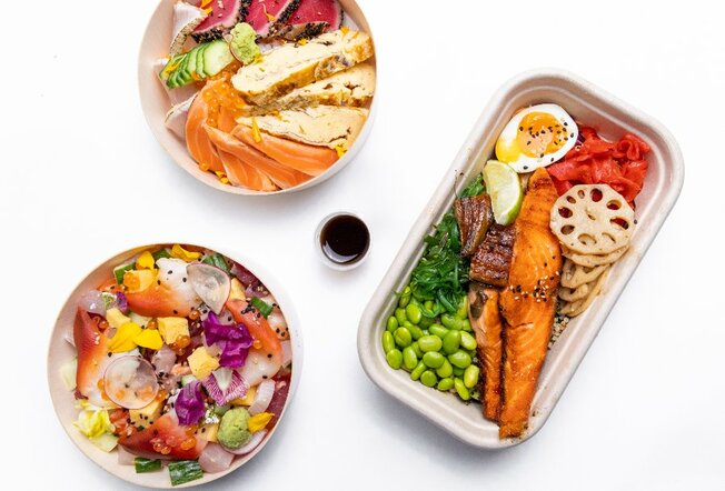 Japanese takeaway dishes including colourful bowls and a salmon bento box.